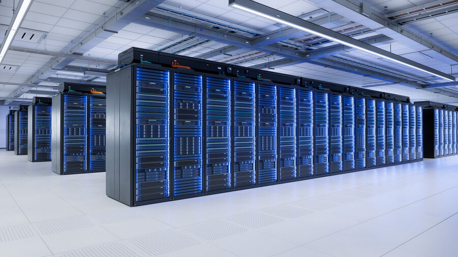 Row of populated server racks in a data center hall, the deployed end state of the rack enclosures SPM fabricates.