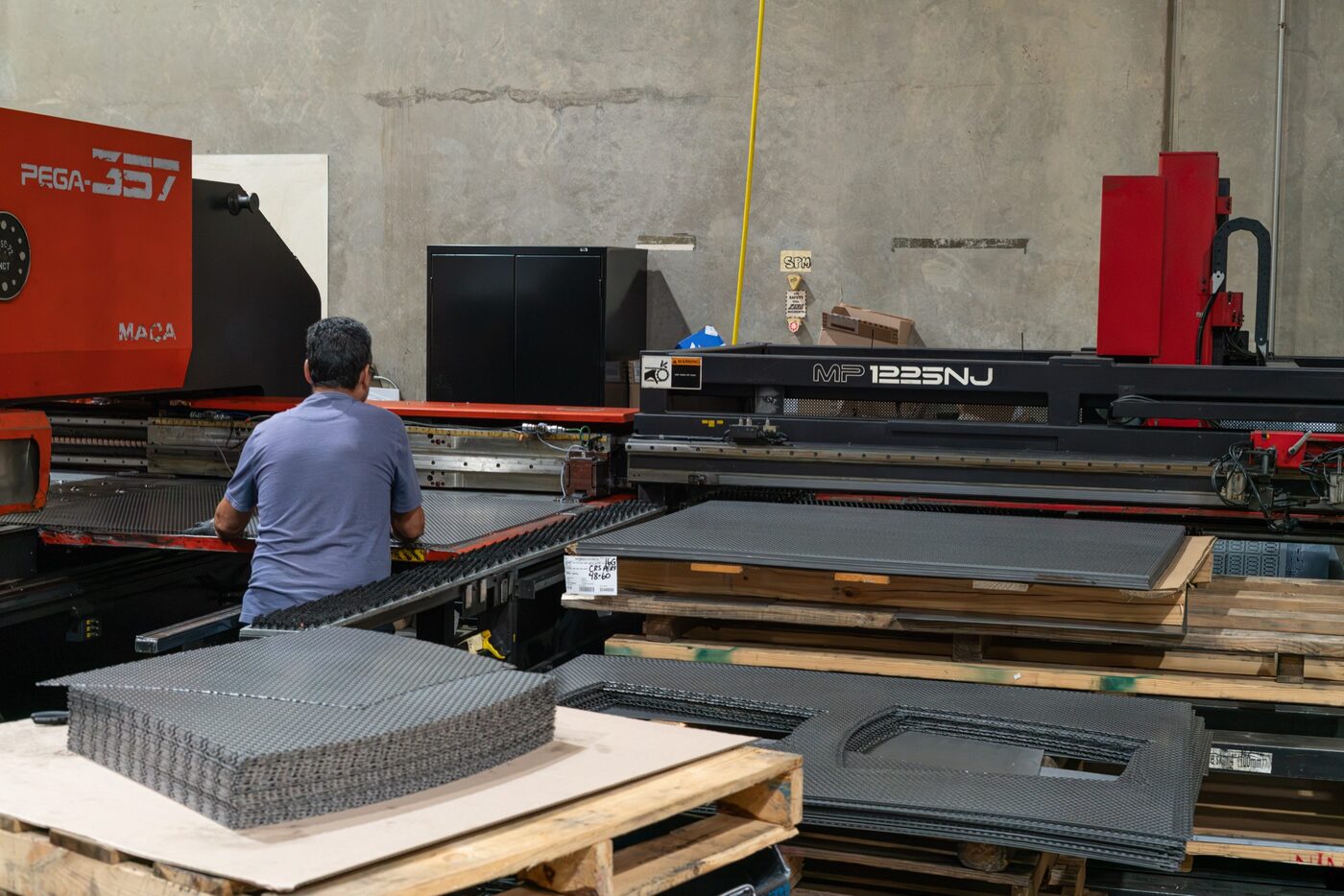 Automated turret punch press on the SPM sheet metal fabrication floor