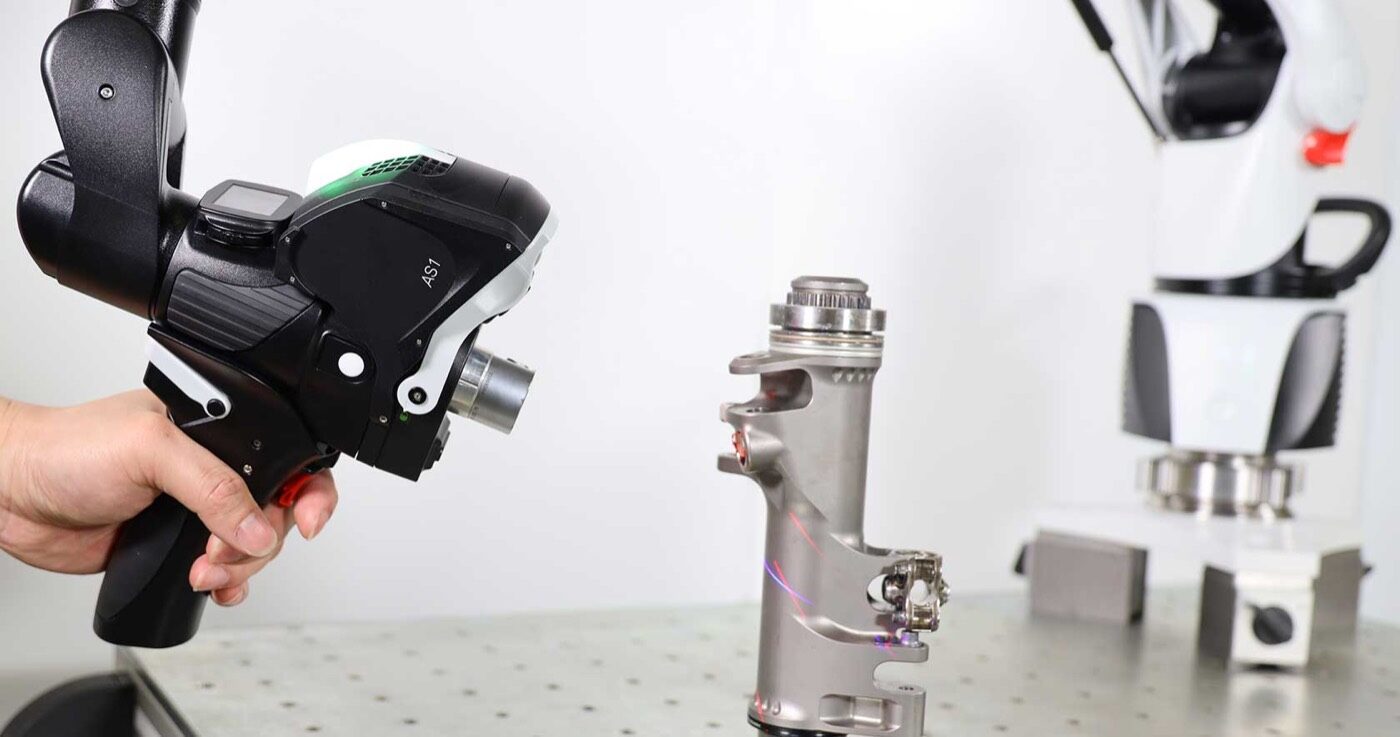 A ROMER portable arm coordinate measuring machine inspecting a fabricated part in the SPM quality lab