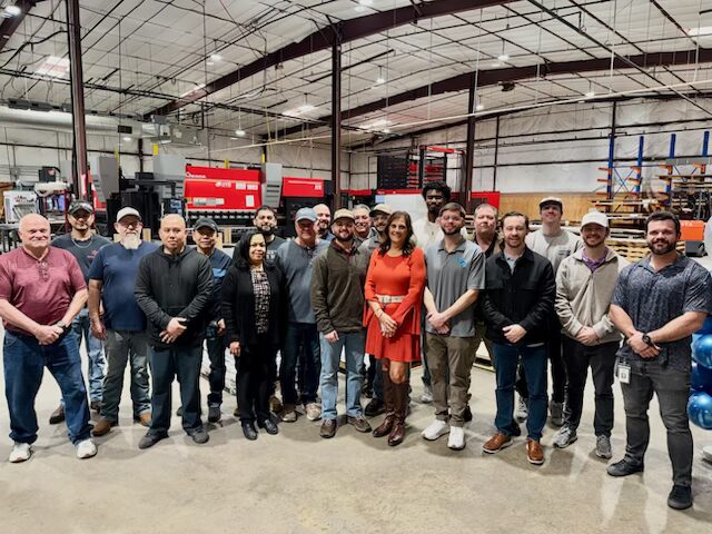 The SPM team gathered together on the Rockwall production floor